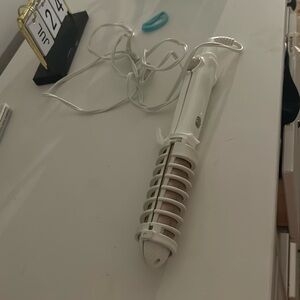 Multi use straightener and curling iron